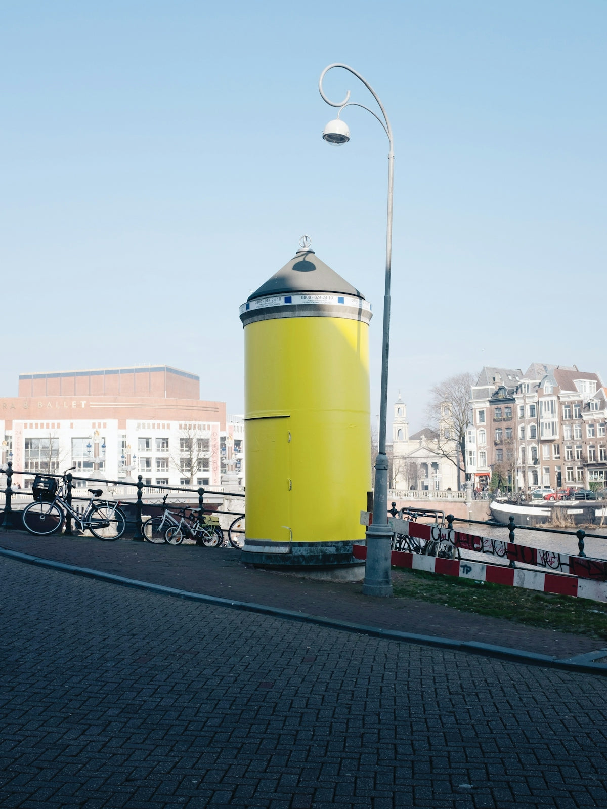 yellow and white water tank on road