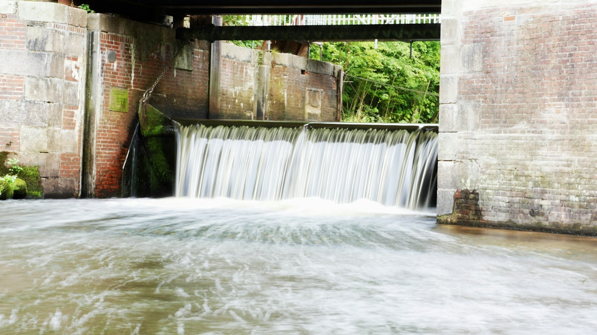 Water flowing over a small dam