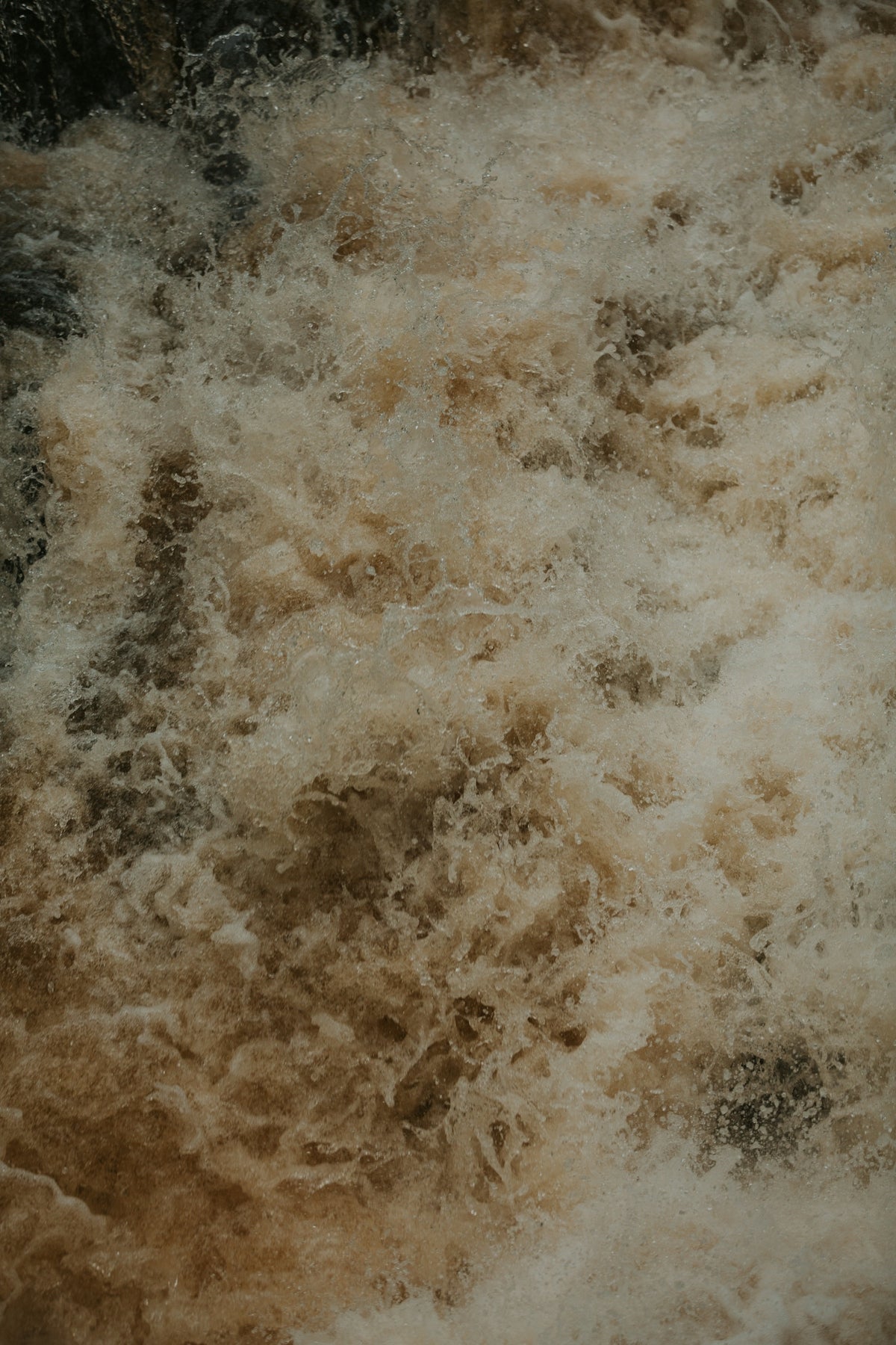 the water is brown and white in color